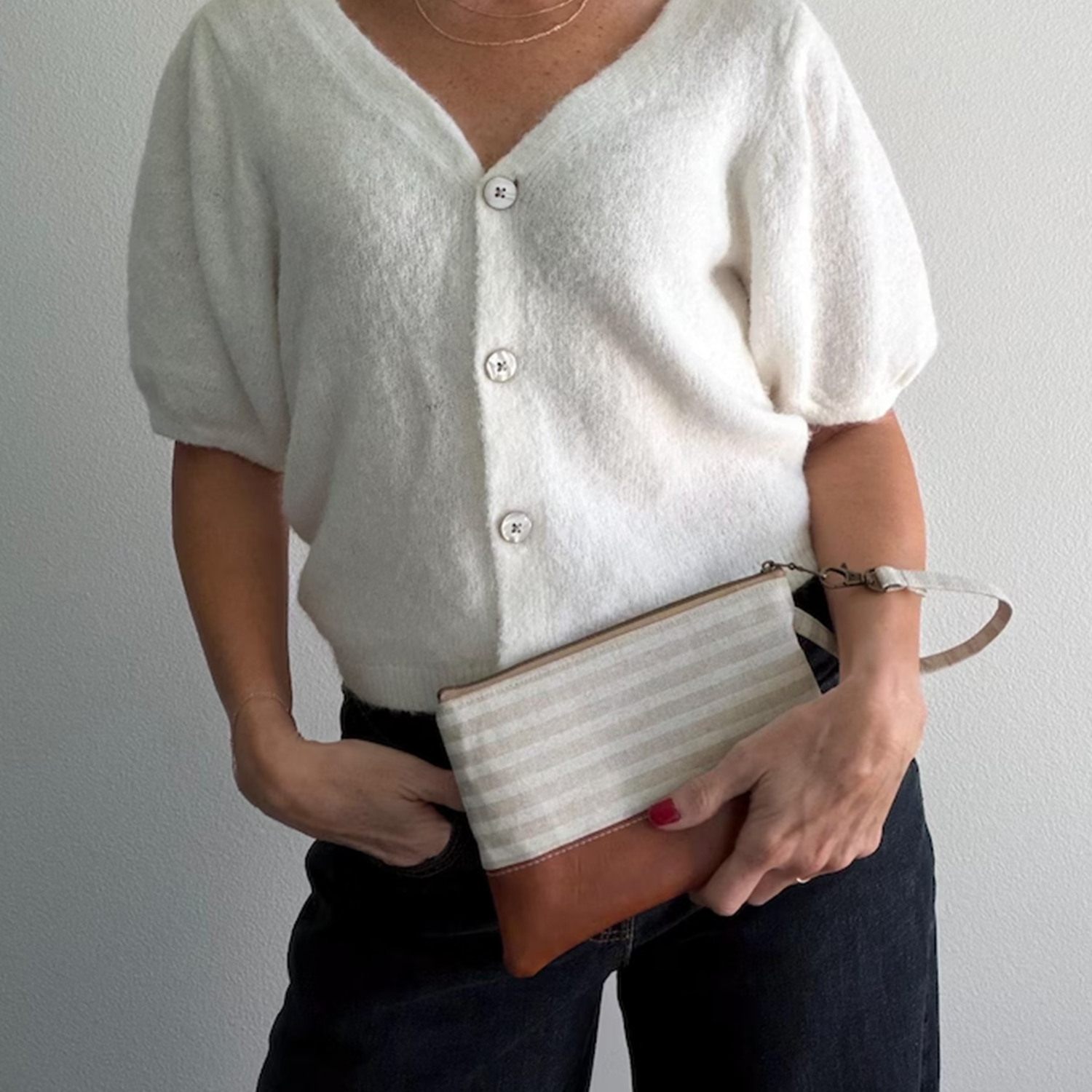Neutral Horizontal Striped Two-Tone Rectangular Wristlet Clutch With Warm Tan Textured Lower Panel, Antique Top Zipper Hardware And Detachable Fabric Wrist Loop Strap