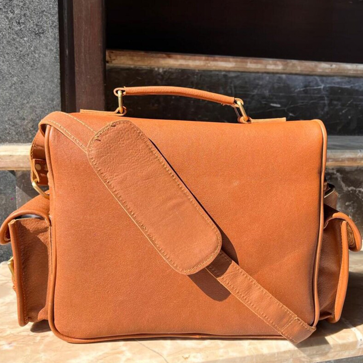 Warm Caramel Tan Natural Grain Rectangular Vintage Gear Satchel With Curved Top Carry Handle, Buckle Snap Front Flap Pocket And Plush Lined Segmented Interior Divider Layout Camera Bag