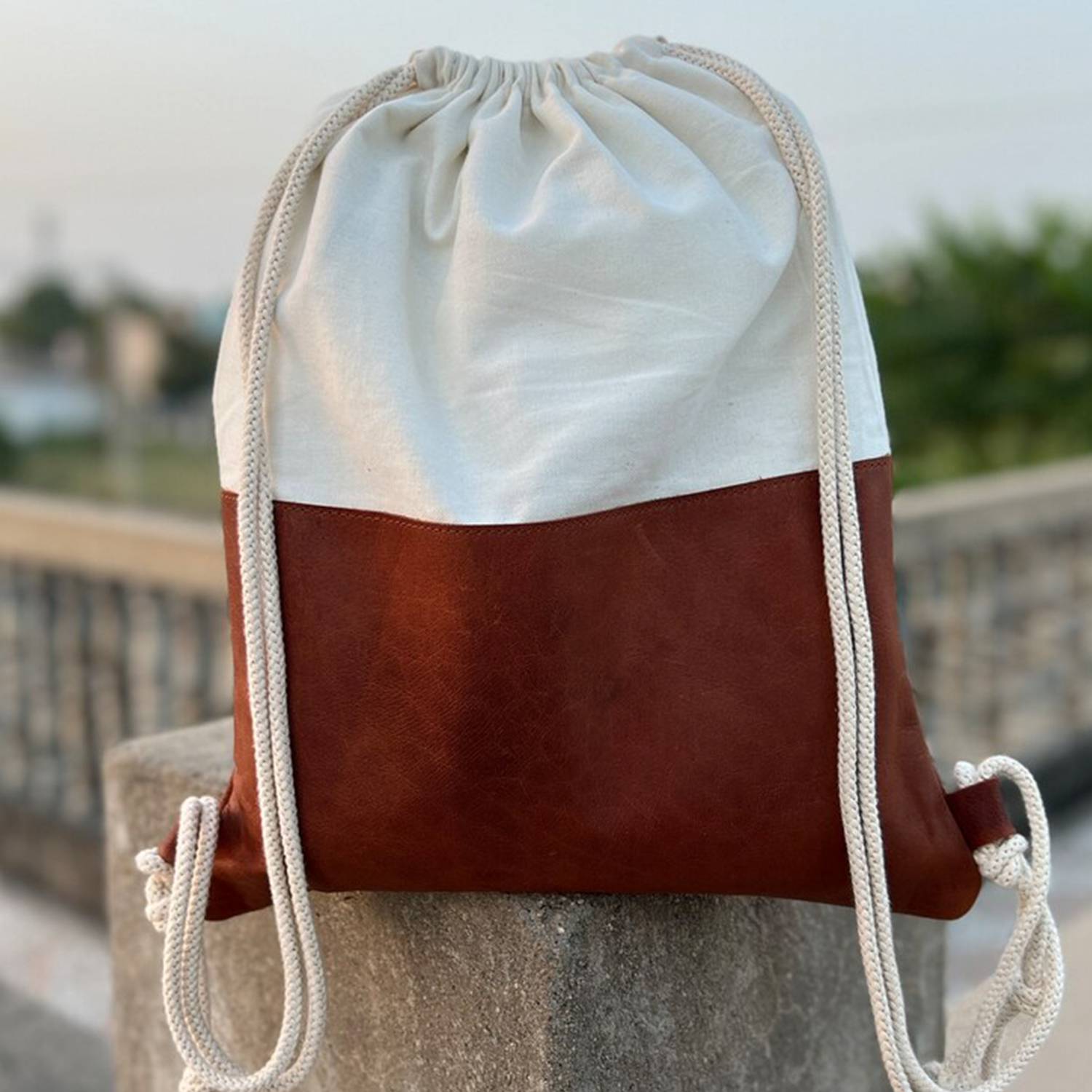 Two-Tone Color Block Drawstring Sack Backpack With Pale Woven Upper Panel, Textured Contrast Base And Twisted Braided Dual Shoulder Cords