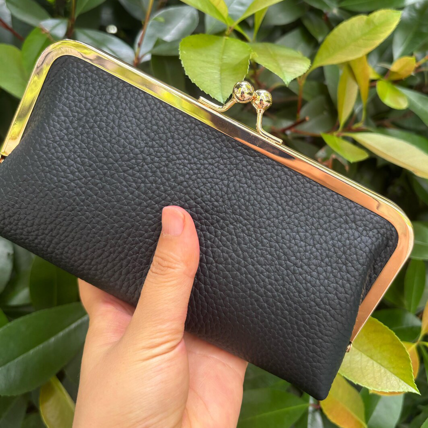 Matte Jet Black Soft Pebbled Grain Elongated Kiss-Lock Clutch With Polished Gold Metal Frame, Spherical Dual Ball Clasp And Detachable Link Chain Shoulder Strap Hardware